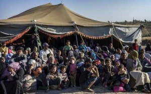 Newly arrived Syrian refugees await transfer to the Za'atri refugee camp from the Jordanian military camp near the border.